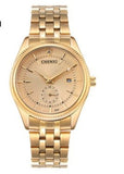 Close-up of quartz watch with metal strap on wrist