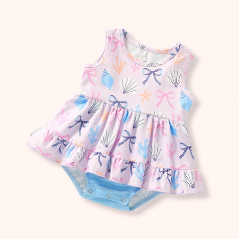 Infant girl wearing Baby Bliss Outfit Set romper, soft and stylish baby clothing for comfort and easy diaper changes