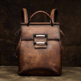 Vintage leather-look women's backpack with structured retro design and adjustable straps in multiple colors